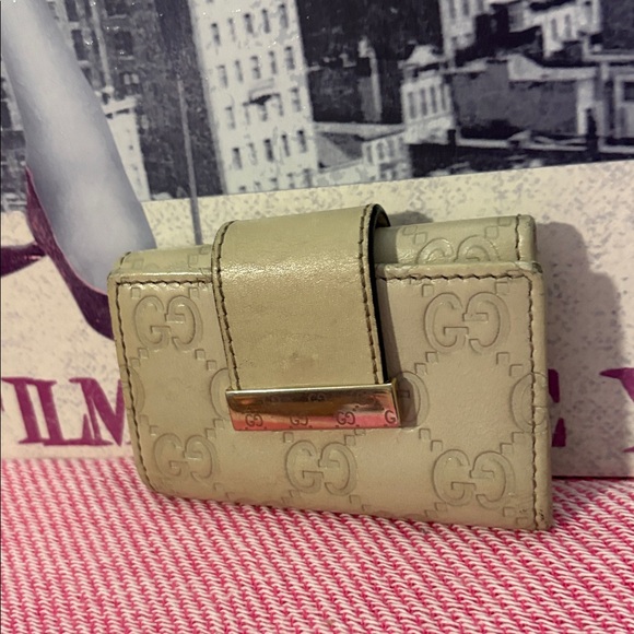 Gucci Handbags - Gucci cream Embossed key case
